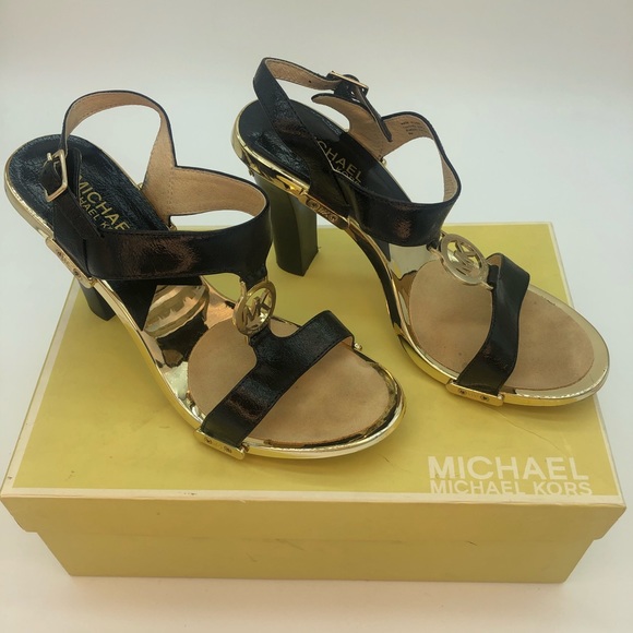 Micheal Kors Black and gold strap heels.